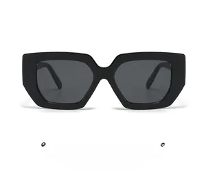 Detail view of stylish oversized black square sunglasses with bold geometric plastic frame