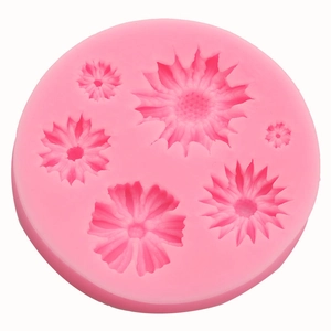 Pink silicone mold featuring five different sizes of detailed 3D rose and flower shapes