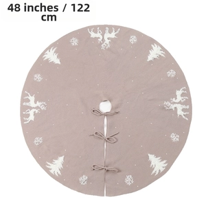 Detail of 48 inch dusty pink knit Christmas tree skirt with reindeer and snowflake patterns