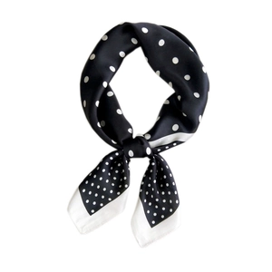Classic black and white polka dot silk square scarf with a smooth satin finish texture