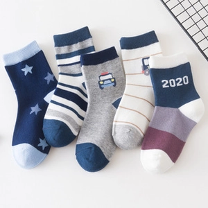 Detail of cotton crew socks with stars, stripes, and cute police car patterns