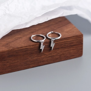 Close-up of S925 sterling silver lightning bolt hoop earrings with cubic zirconia stones