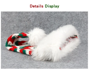 Detail display of striped Christmas scarf with soft white faux fur pom poms and knit texture