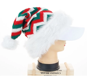 Detail of red and green striped knit Santa hat with white faux fur trim and pom pom
