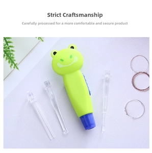Detail view of frog-shaped electric ear pick with three transparent replacement heads