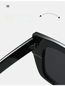 Detail of durable reinforced metal hinges on square oversized black sunglasses