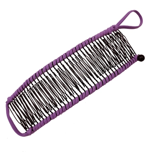 Detail of purple fabric wrapped banana hair clip with metal teeth and elastic closure