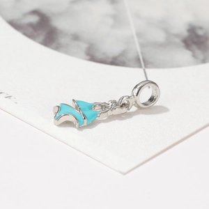 Macro shot of a silver dress charm with sky blue enamel finish for DIY bracelets