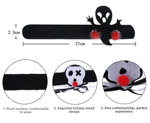Detail view of Halloween slap bracelet with ghost and skull designs on soft velvet material