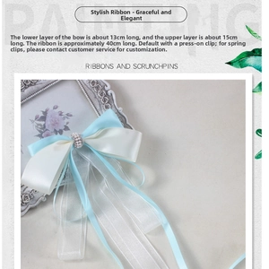 Detail of light blue bow hair clip with measurements 13cm and 15cm, ribbon length 40cm