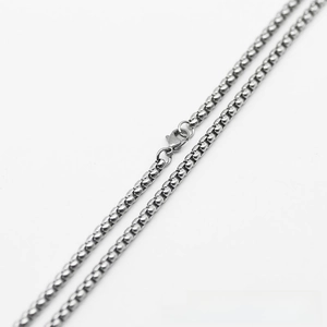 Close-up of polished stainless steel box chain with a secure lobster clasp closure