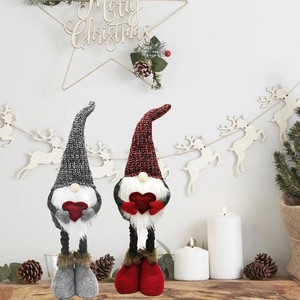 Detail of Christmas gnomes with long telescopic legs and red hearts for holiday decor