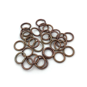 Close-up of antique copper alloy open jump rings for DIY jewelry making accessories