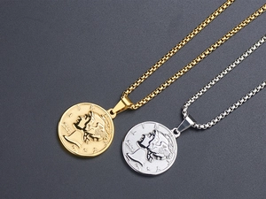Detailed close-up of gold and silver vintage coin pendants with 3D embossed portrait design