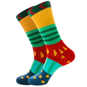 Macro detail of colorful striped mid-calf socks with geometric patterns and dots