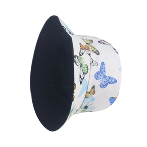 Detail of white cotton bucket hat with colorful butterfly prints and black inner lining