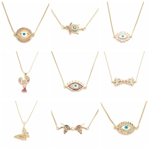 Golden micro-pave pendant collection with evil eye turtle lobster and butterfly charms