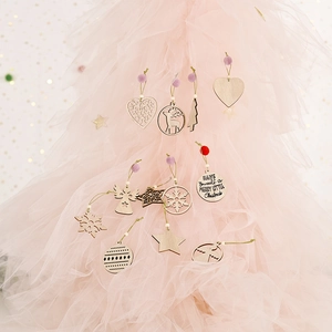 Creative Christmas wood pendant set with star heart and deer shapes on pink tulle background
