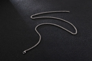 Detailed shot of silver stainless steel cable chain with secure lobster clasp closure