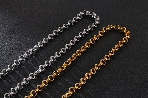 Detail of classic O-link chain necklaces in polished gold and silver stainless steel finishes