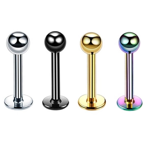 Macro shot of 4-piece stainless steel piercing rings in silver black gold and rainbow colors