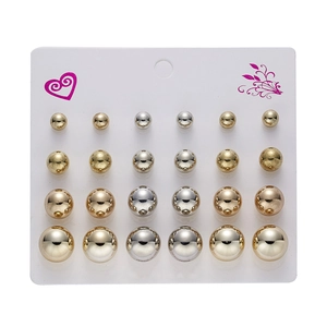 Set of 12 pairs of gold and silver ball stud earrings in varied sizes on a display card