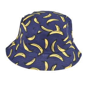 Close-up of navy blue canvas bucket hat with bright yellow banana pattern and neat stitching