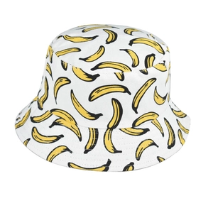 Detail shot of a white cotton bucket hat featuring all-over yellow banana print patterns