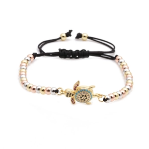 Adjustable turtle bracelet with zircon stones and tricolor metallic beads on black cord