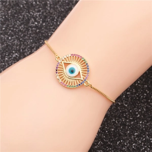 Adjustable golden Evil Eye bracelet featuring micro-pave multi-color cubic zirconia
