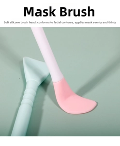 Detail of pink and blue dual-ended silicone face mask brushes with flat fan heads