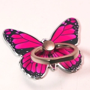 Close-up of pink butterfly phone ring holder with gold metal rotatable stand
