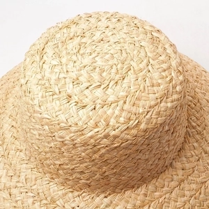 French style cloche straw hat for women featuring elegant raffia woven texture in beige