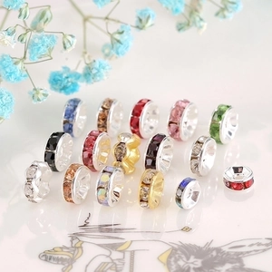 Macro shot of colorful rhinestone spacer beads with gold and silver bases for DIY jewelry