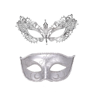 Detail of silver Venetian masquerade masks with metal hollow lace and glitter embossed designs