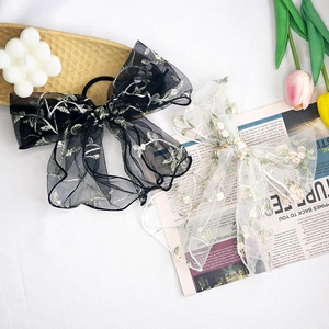Elegant silk mesh bow hair clip with floral embroidery in black and cream white colors