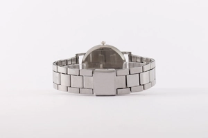 Detailed close-up of the silver metal watch band and secure folding clasp mechanism