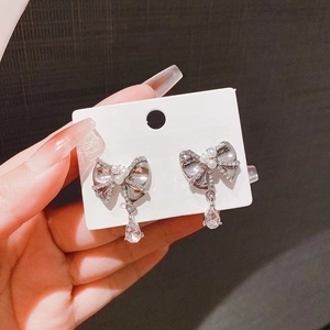 Elegant bow-knot earrings with S925 silver post, pearls, and teardrop crystal pendant