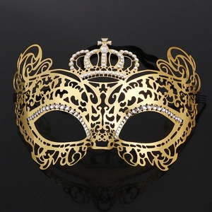 Detailed front view of golden crown filigree mask with rhinestones on black background