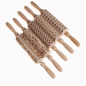 Set of 5 Christmas themed wooden rolling pins with engraved snowflake and tree patterns