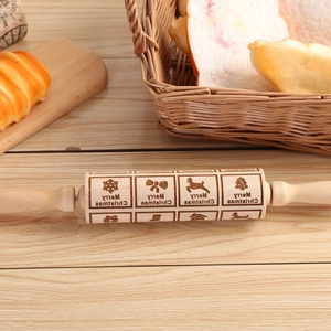 Wooden Christmas rolling pin with snowflake and reindeer engravings for baking cookies