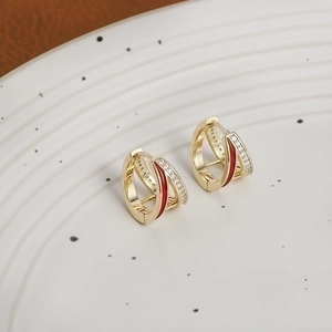 Elegant gold hoop earrings with red enamel and micro-pave cubic zirconia stones