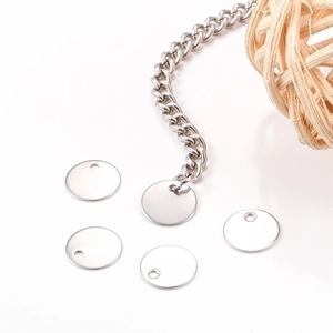Polished stainless steel round pendant tags for DIY jewelry making on white background