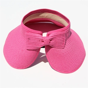 Pink wide brim straw sun hat with large bow and breathable sweatband for summer beach