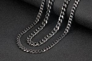 Macro shot of vintage style stainless steel curb link chains in two different sizes