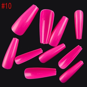 Glossy long coffin press-on nails in light pink color against black background
