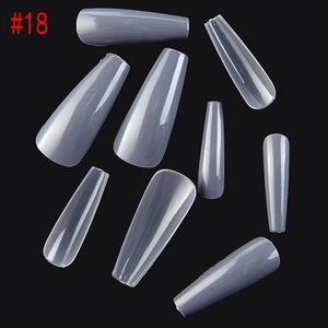 Detail view of 8 grey and clear coffin press-on nails in various sizes on black background