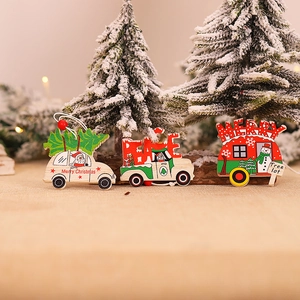 Christmas wooden car ornaments set with tree and camper hanging on a festive background