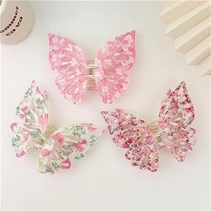 Set of three double-layer butterfly hair claws with pink floral patterns in resin