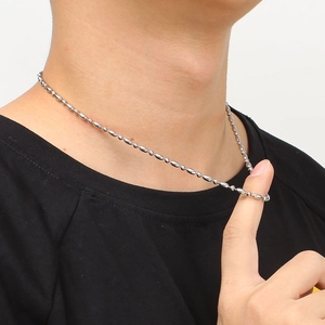 Unisex stainless steel silver bead chain necklace displayed on a black shirt neck